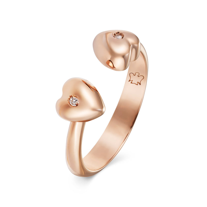 Anello contrarie in oro rosa con cuori e diamanti