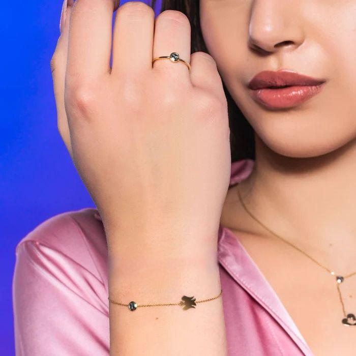 Bracciale in oro con punto luce e angelo